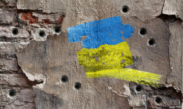 Ukrainian colors on damaged wall