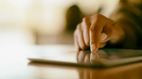 Close-up of a hand using a tablet