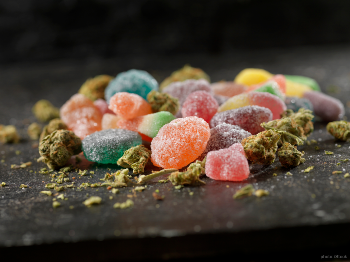 Gummies lying on a table with cannabis herb